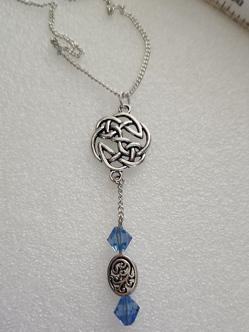 Hand Crafted Silver Celtic Knot Necklace with Blue Crystals